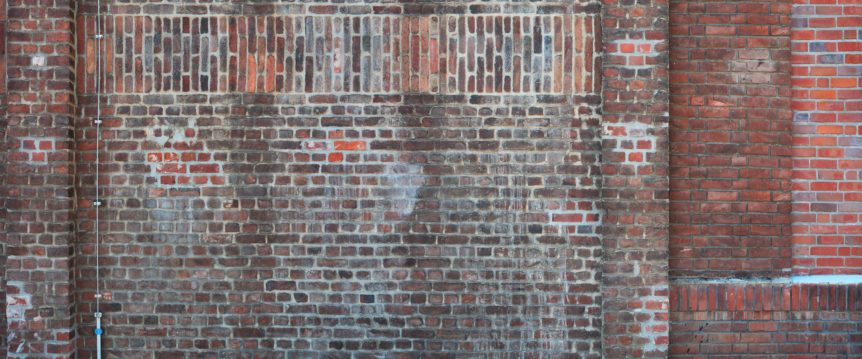             Fototapete rote Backstein Mauer im Industrial Stil
        