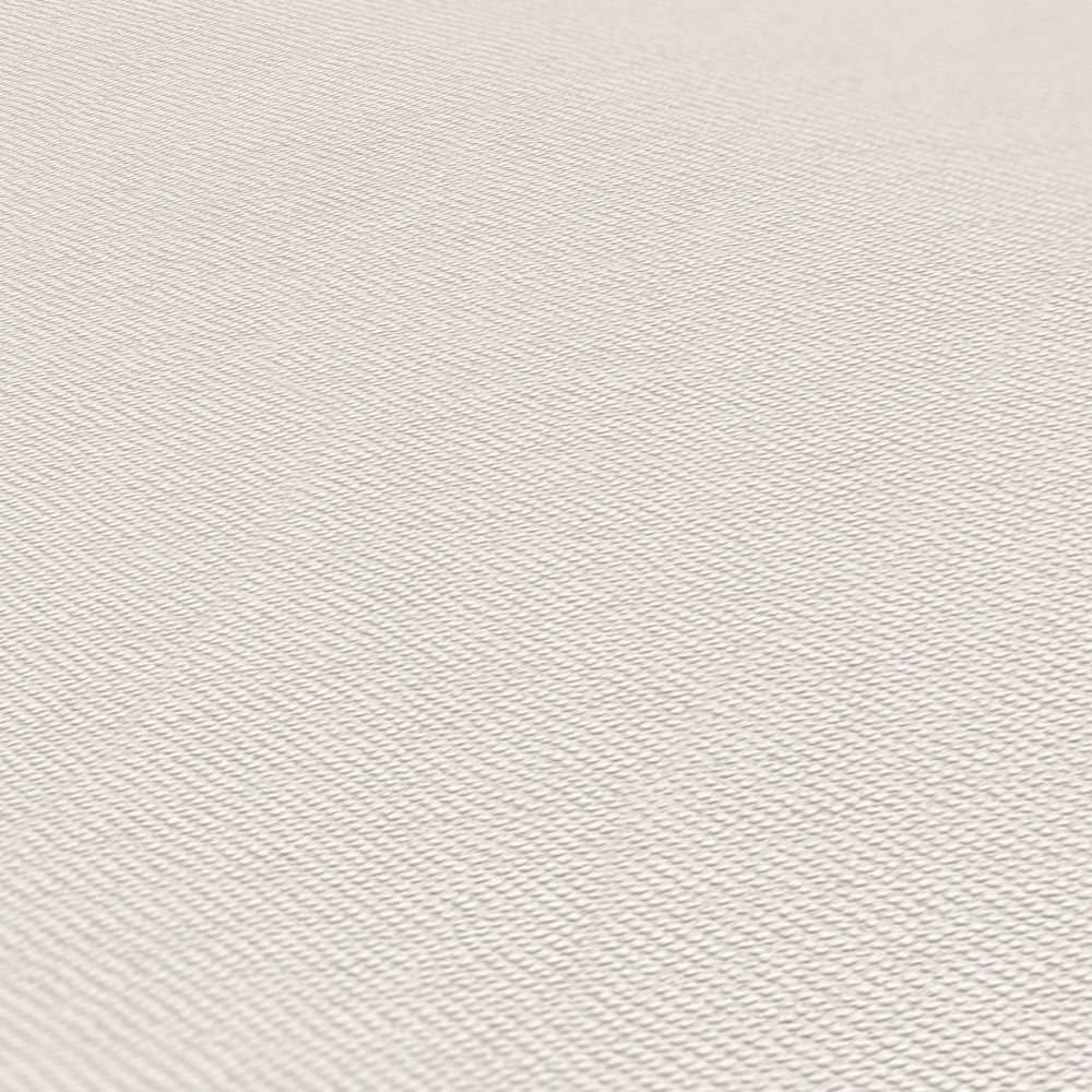             Uni Tapete Creme mit Textilstruktur im eleganten Design
        