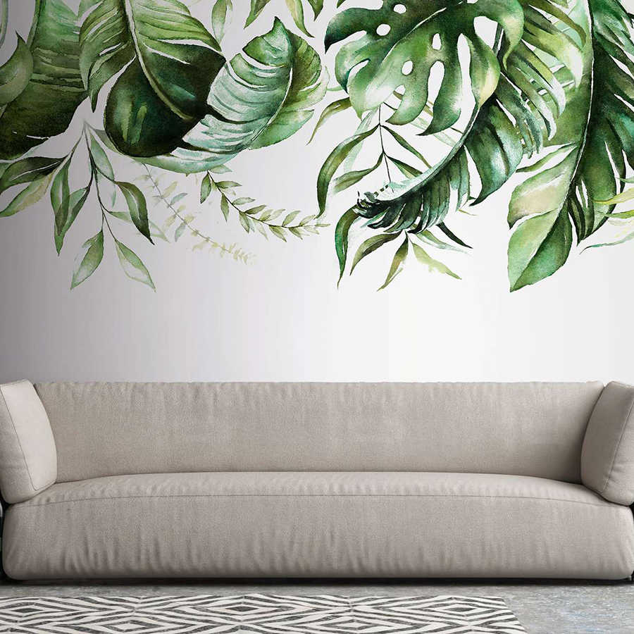 Fototapete mit tropischen Blätterranken auf einer Wand – Grün, Weiß
