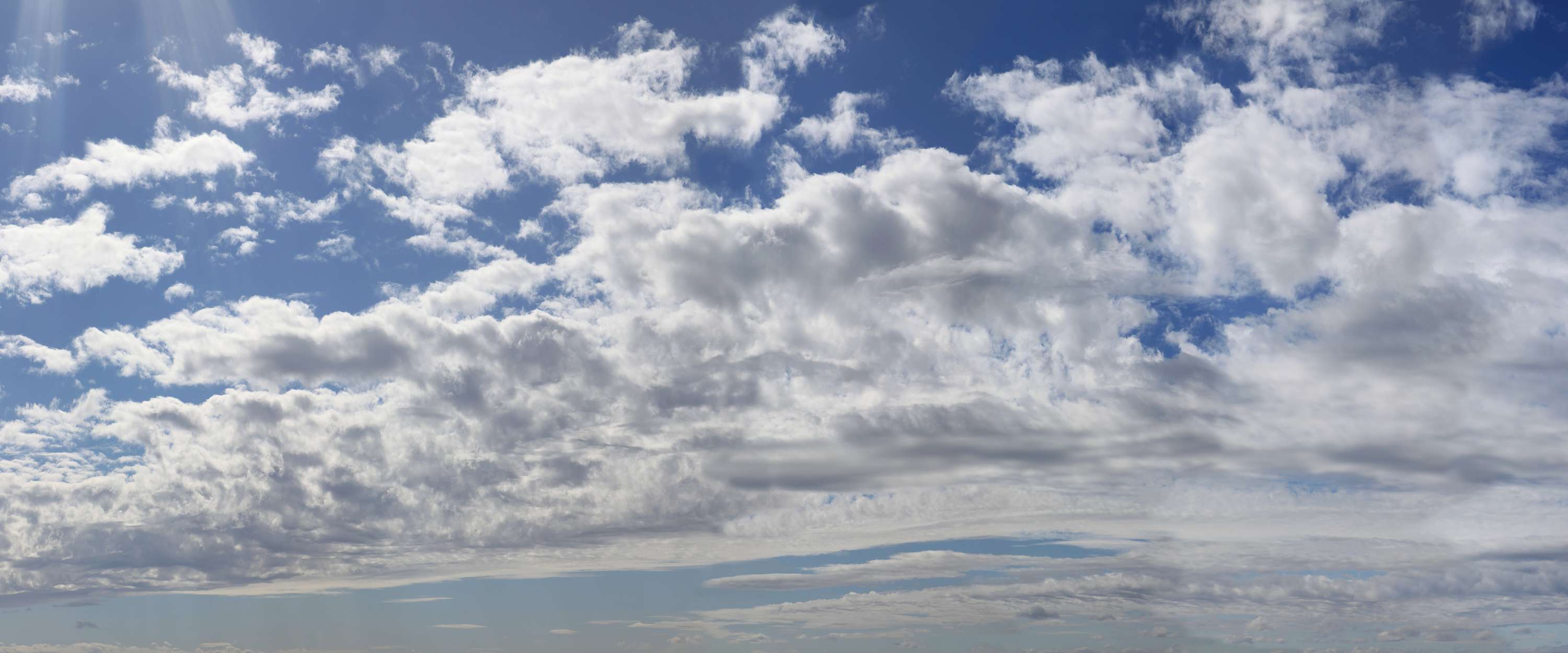             Himmel wolkig – Fototapete Wolkenzug mit blauem Himmel
        