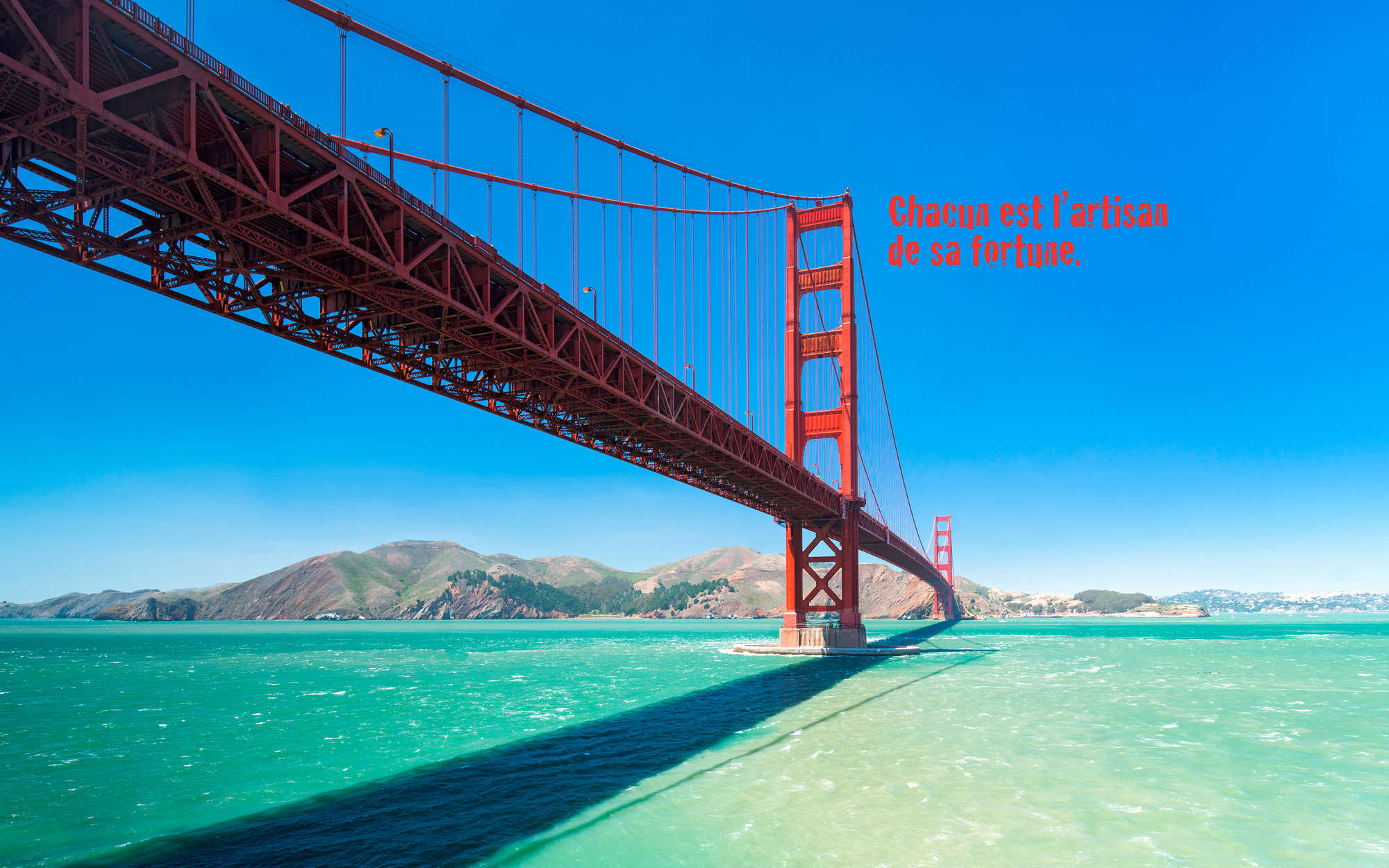             Fototapete Golden Gate Bridge mit Schriftzug auf französisch – Perlmutt Glattvlies
        