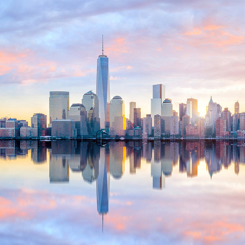         Fototapete New York Skyline am Morgen – Blau, Grau, Gelb
    