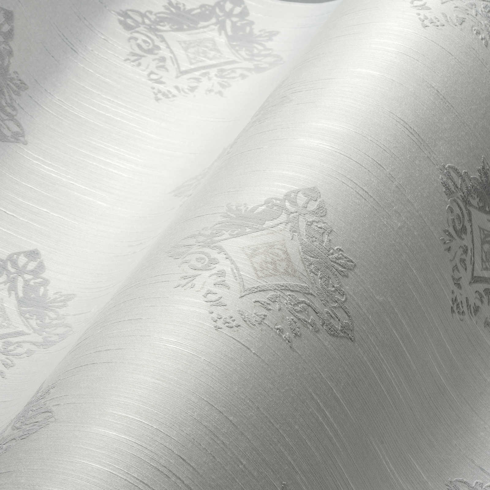             Vliestapete Putzoptik mit Stuck-Ornamenten & Rauten Muster – Grau, Weiß
        