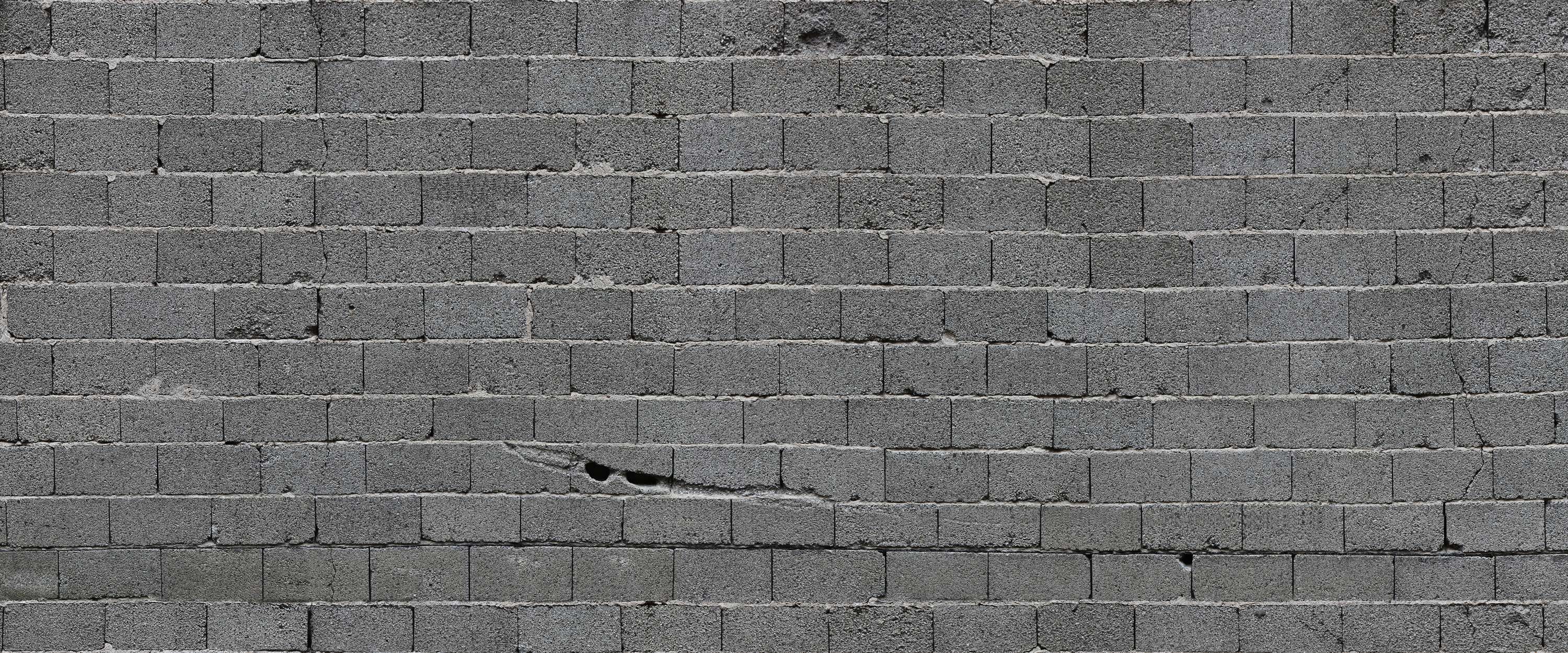             Fototapete graue Steinmauer mit Betonbausteinen
        