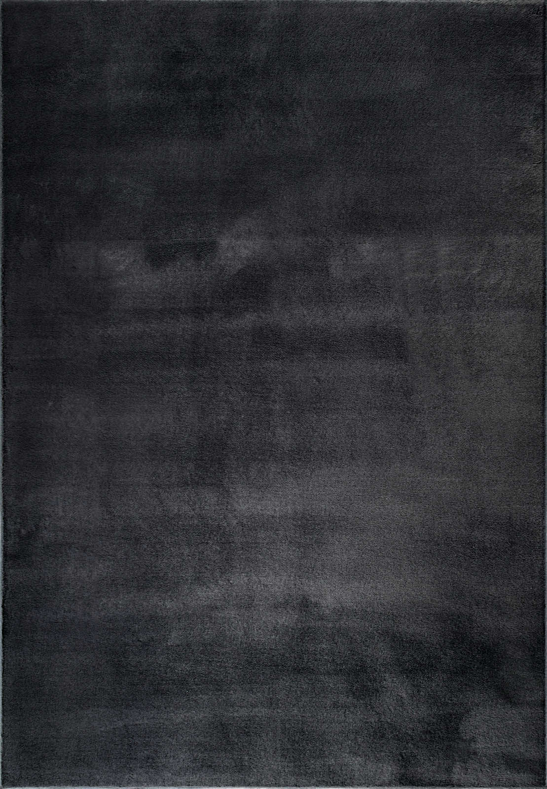             Kuschelweicher Hochflor Teppich in Schwarz – 100 x 50 cm
        