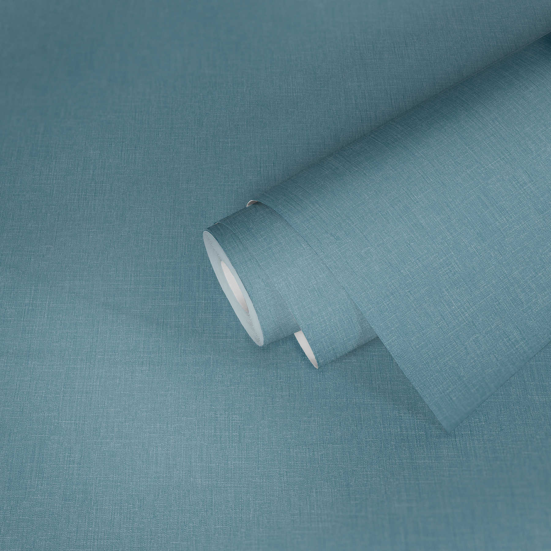             Vliestapete Blau meliert mit Textilstruktur im Bouclé Stil
        