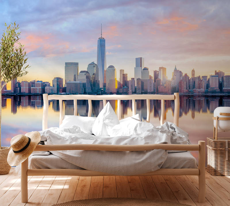             Fototapete New York Skyline am Morgen – Blau, Grau, Gelb
        