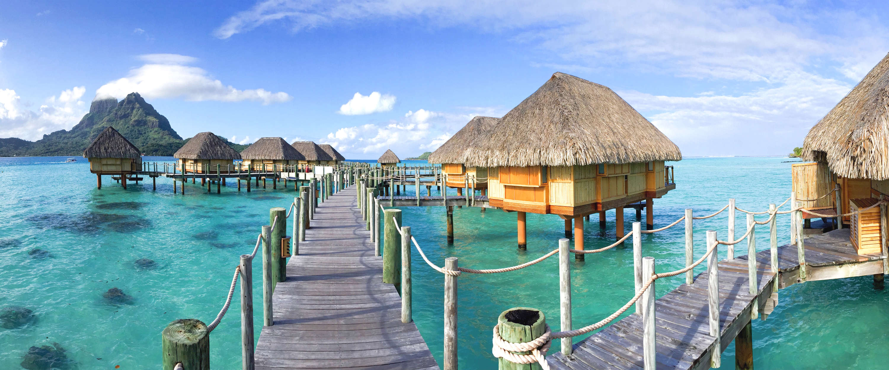             Exotische Fototapete Tahiti Bungalows im Wasser
        