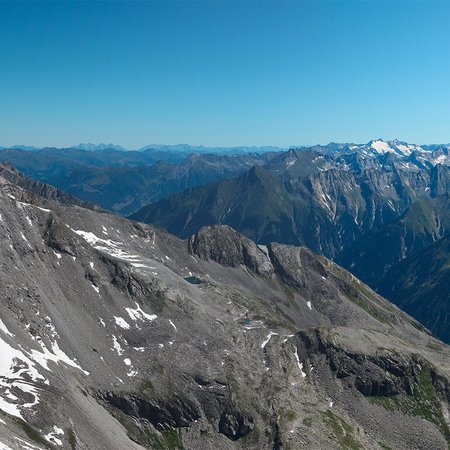Panorama Fototapete mit zerklüftetem Alpengebirge
