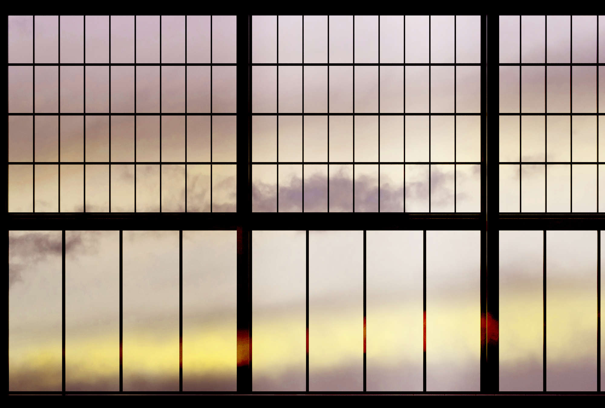             Sky 2 - Fototapete Fenster Ausblick Sonnenaufgang – Gelb, Schwarz | Mattes Glattvlies
        