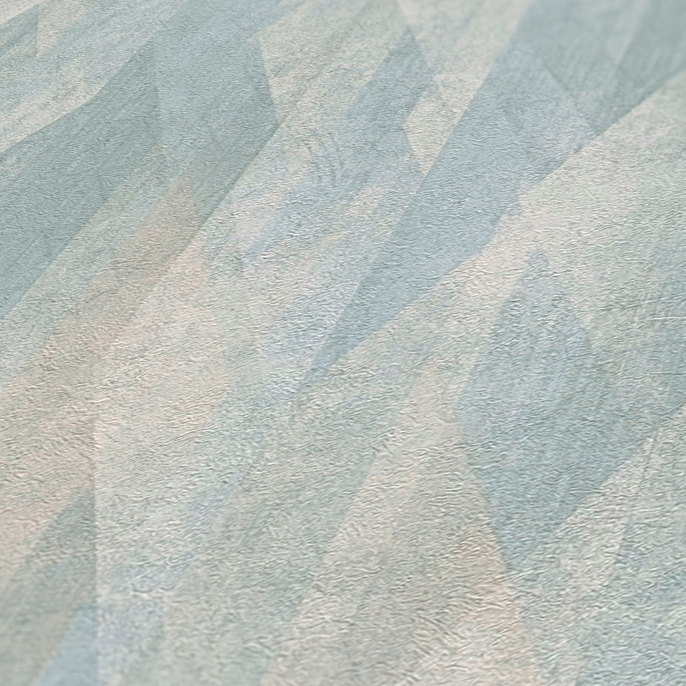             Mustertapete mit grafischen Rauten – Türkis, Blau, Creme
        