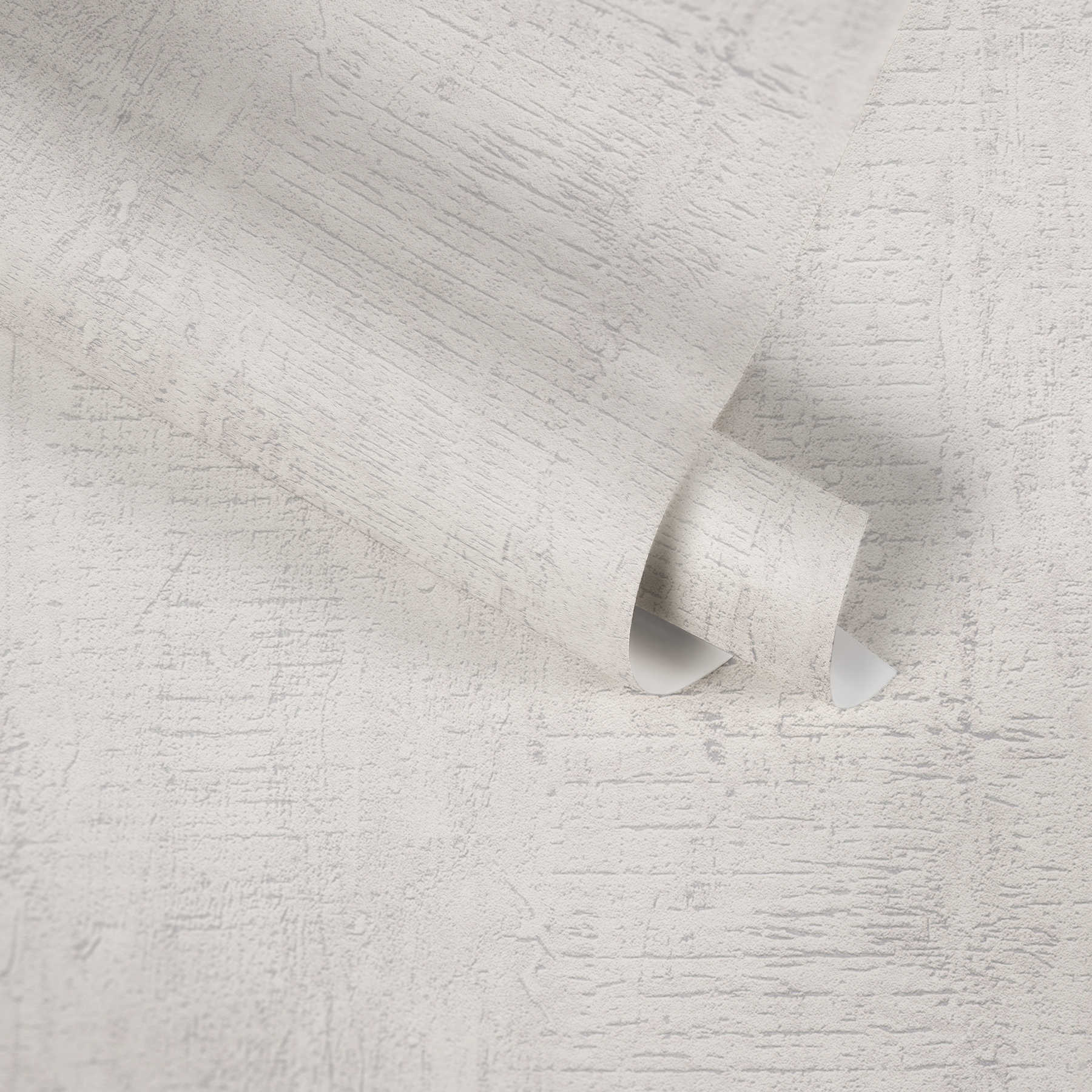             Tapete Betonoptik mit rustikaler Struktur mit rauem Muster – Weiß
        