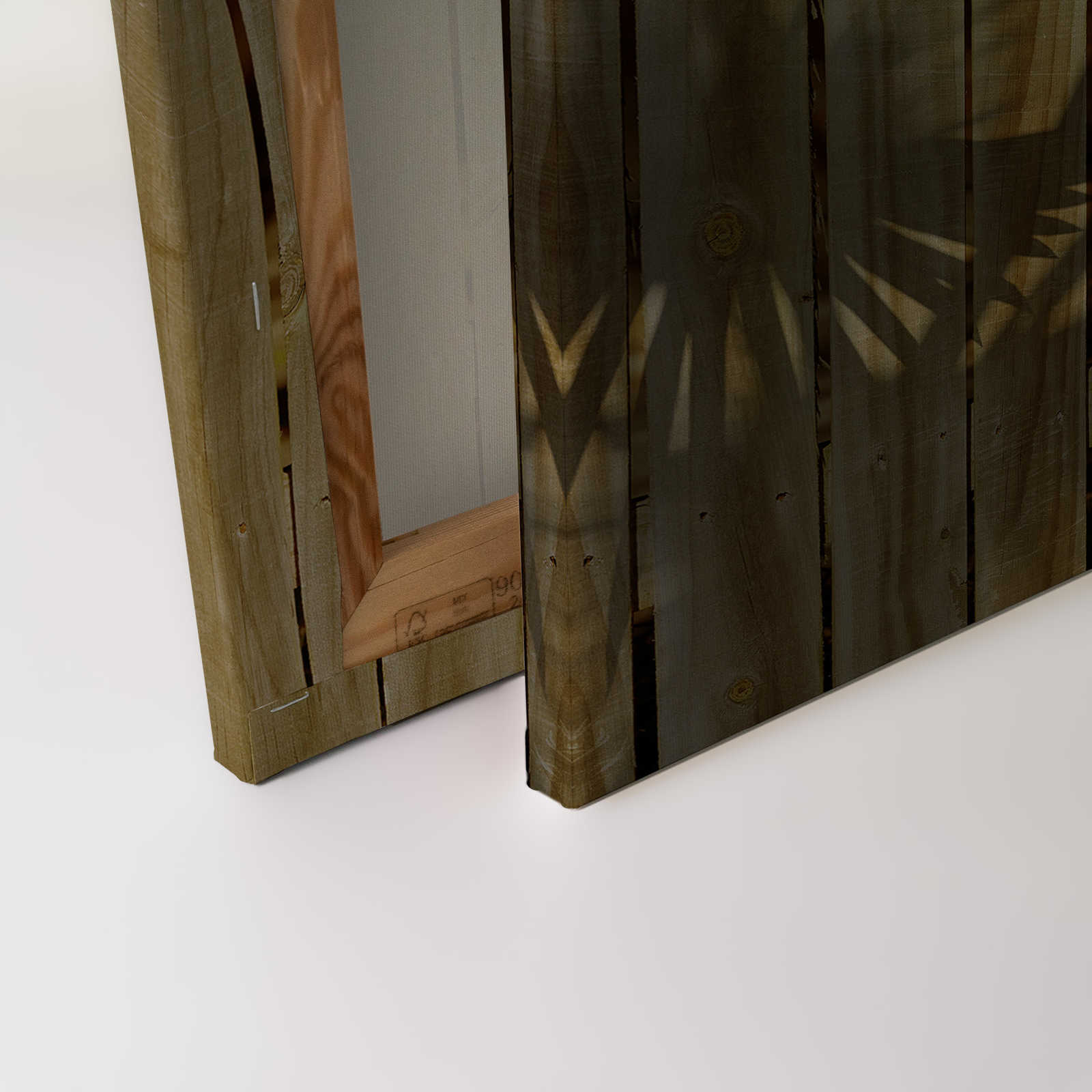             Leinwandbild mit Holzoptik und Palmblatt-Schatten – 0,90 m x 0,60 m
        