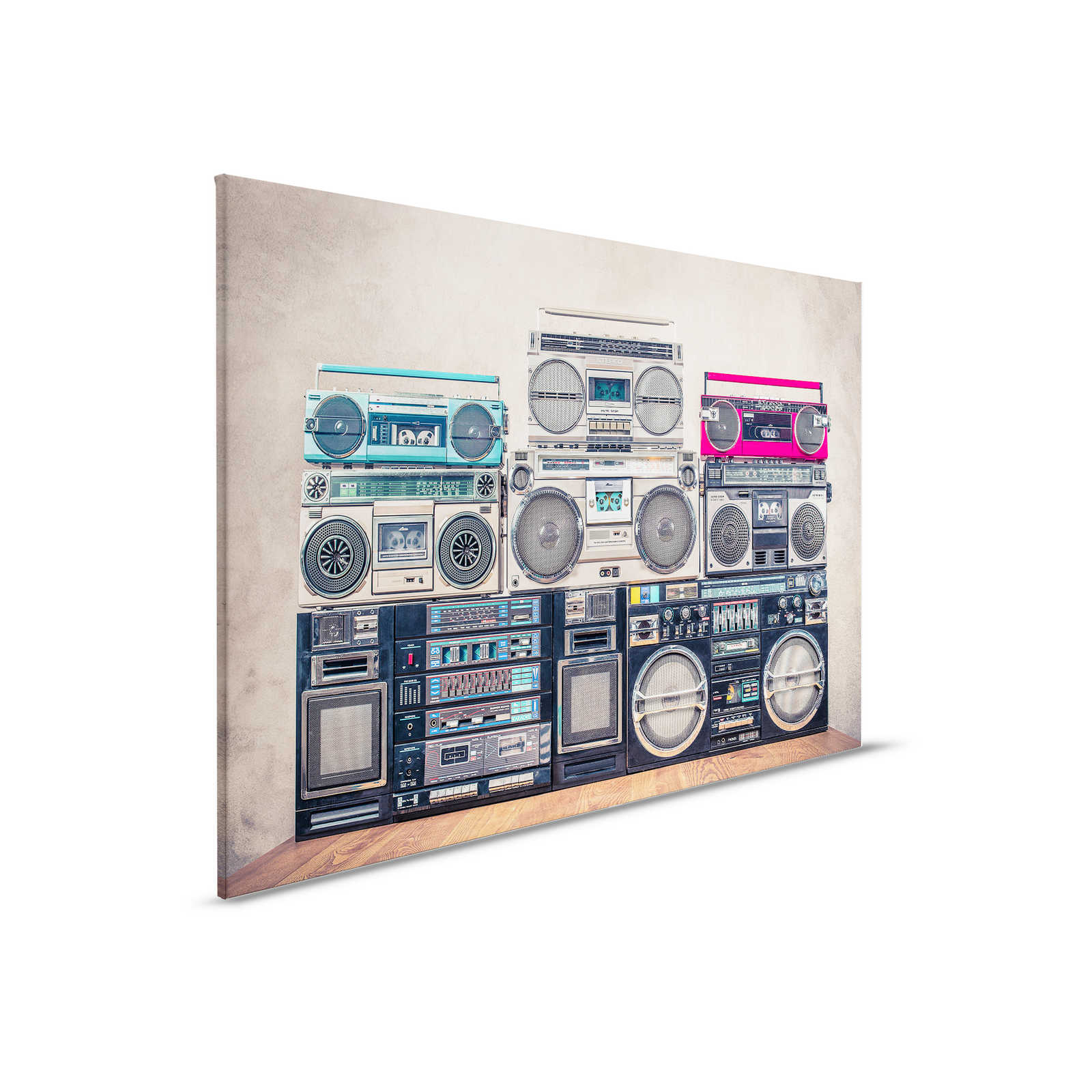         Leinwandbild Radios auf Holztisch vor Wand – 0,90 m x 0,60 m
    