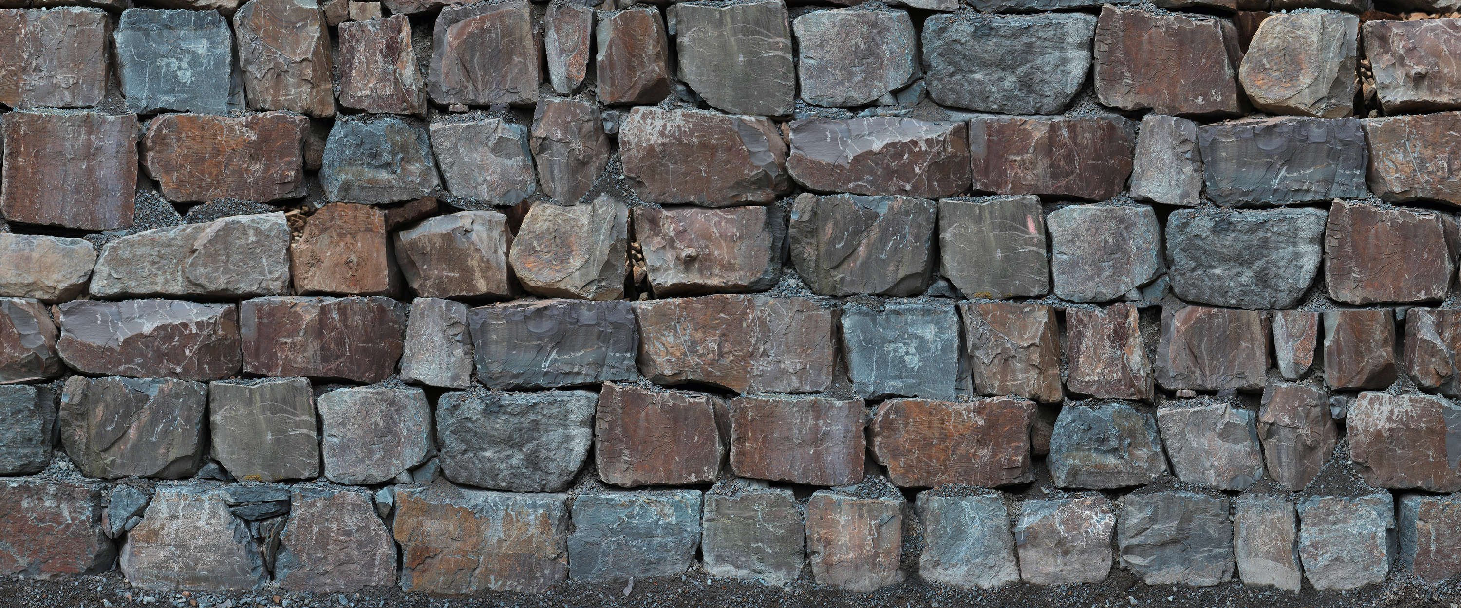             Steinmauer Fototapete mit großen Felsbrocken
        