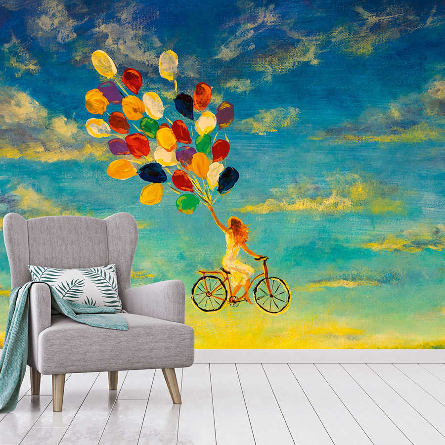 Fototapete mit Frau auf Fahrrad im Himmel Gemälde – Blau, Gelb, Bunt
