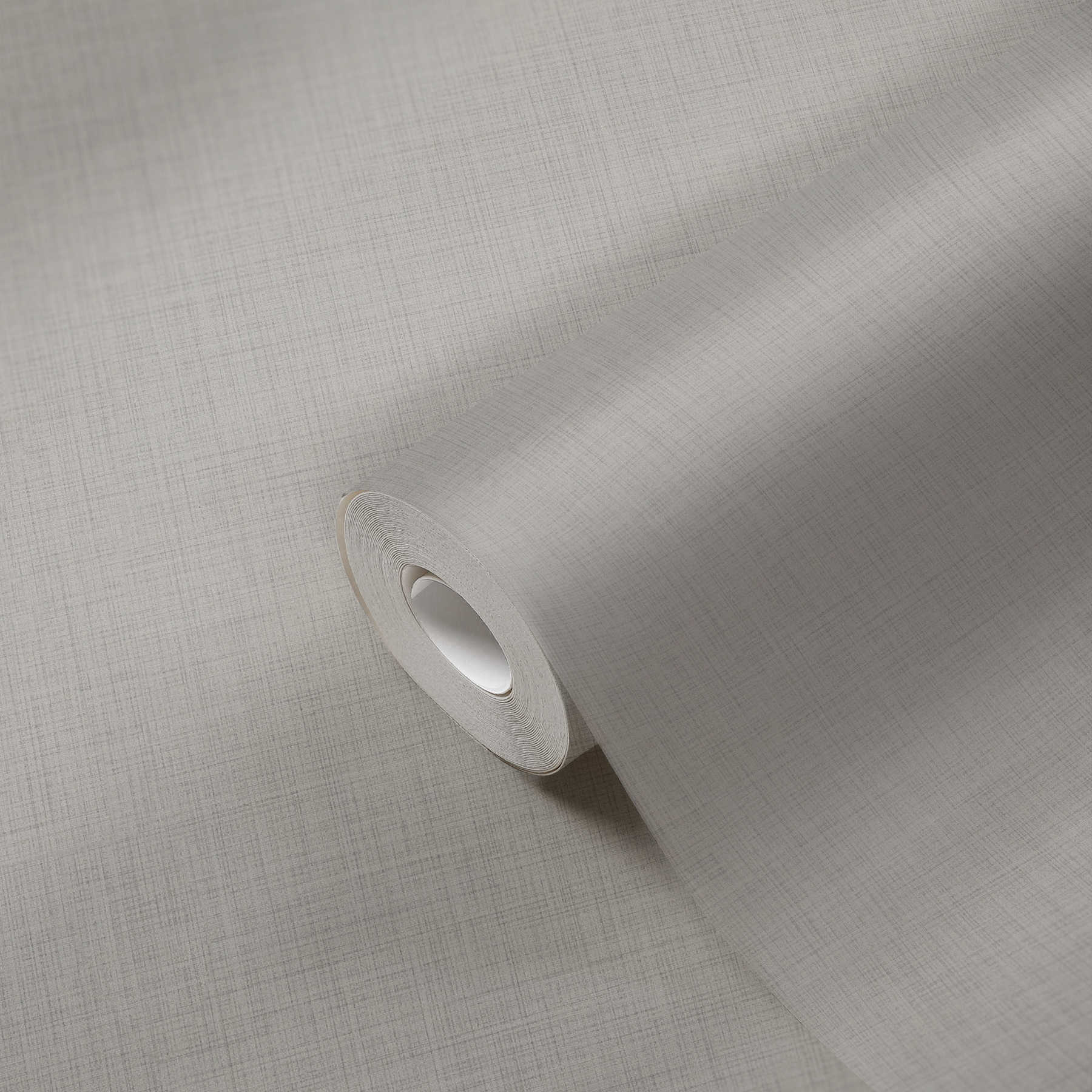             Melierte Tapete Beige Grau meliert mit textilem Muster
        