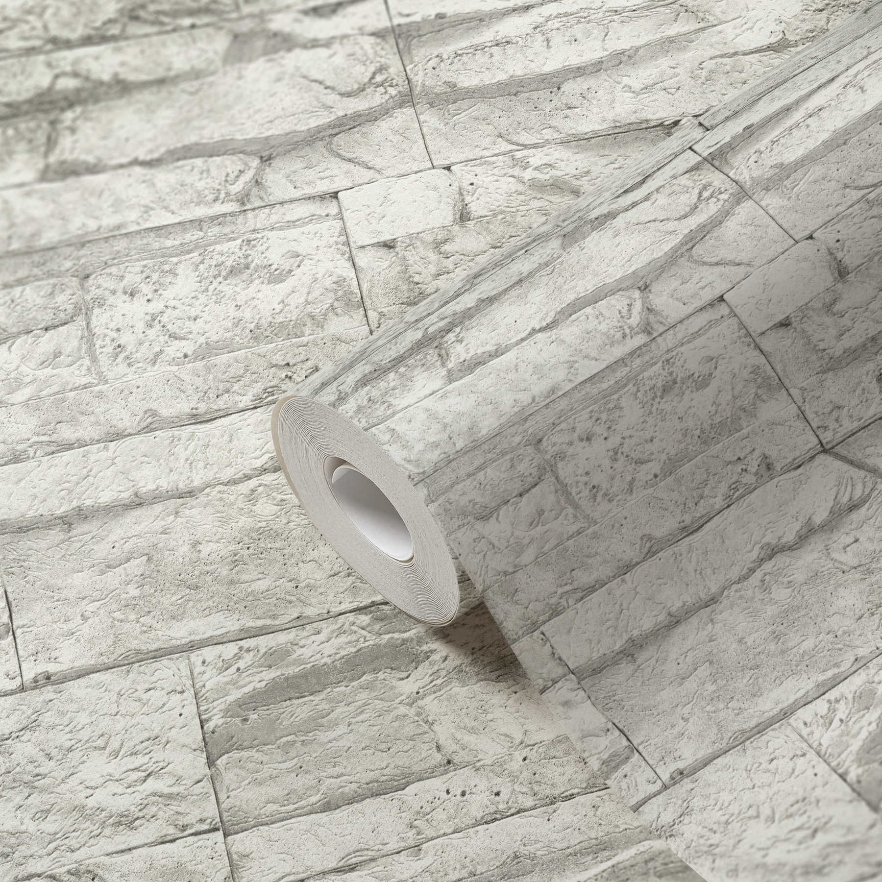             Tapete mit hellem Mauerwerk aus Natursteinen – Weiß, Grau
        